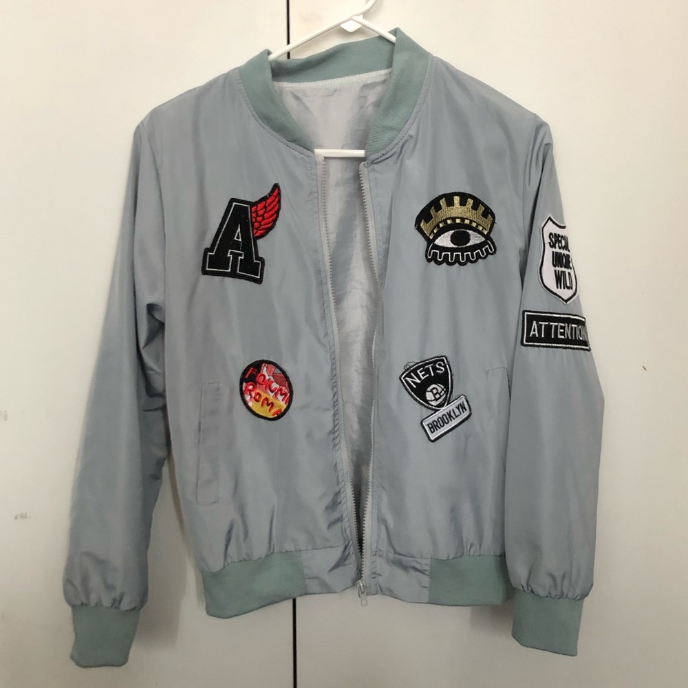 Patched bomber jacket